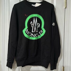 Moncler crew neck pullover sweatshirt fits like a women’s oversized small.